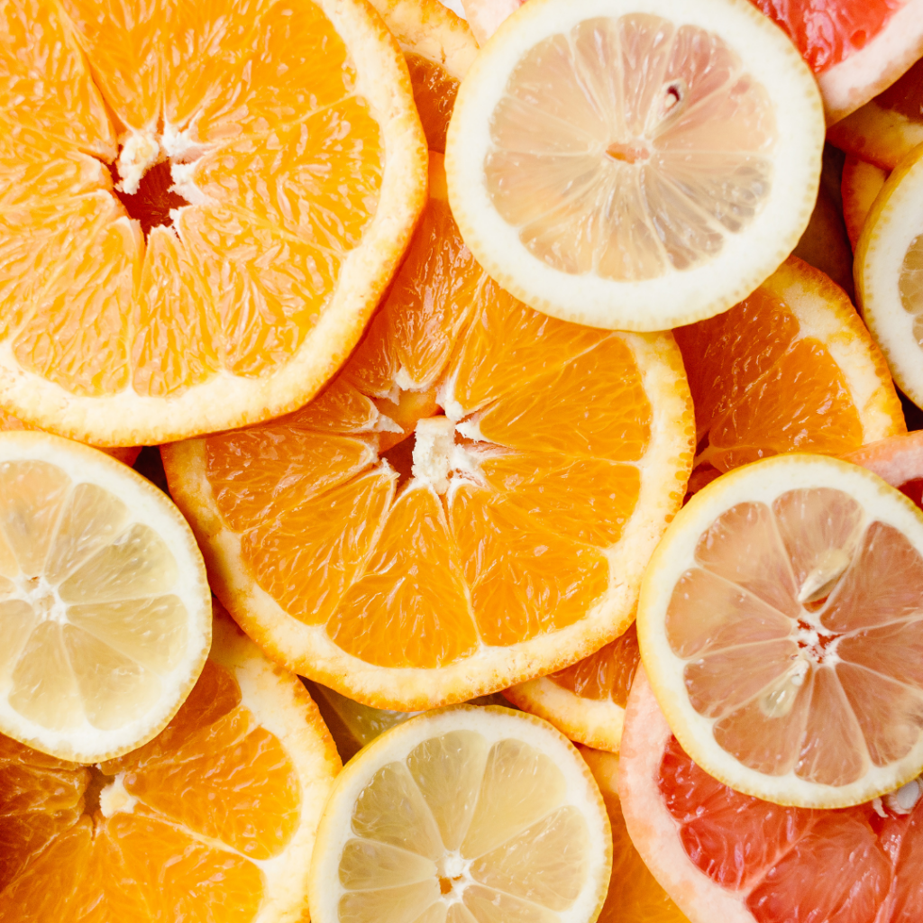 Sliced oranges, lemon, and grapefruit to use in edible sensory play.