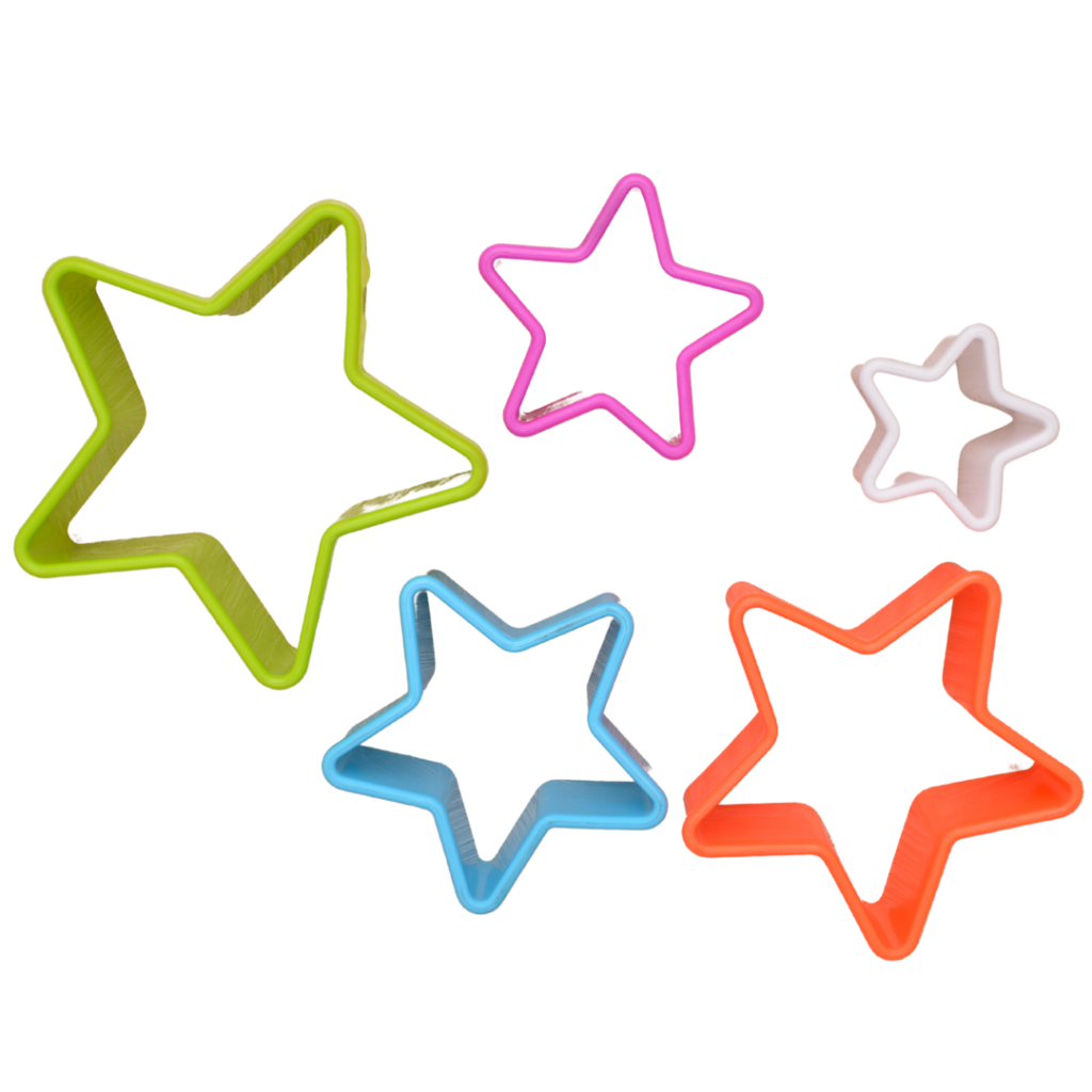 Various sizes and colors of star shaped cookie cutters to use in various food play ideas with different foods.