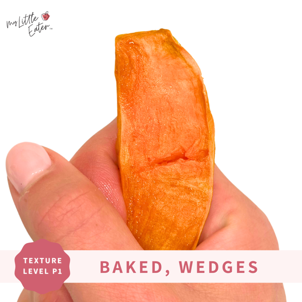 Baked sweet potato wedges being held with palmar grasp.