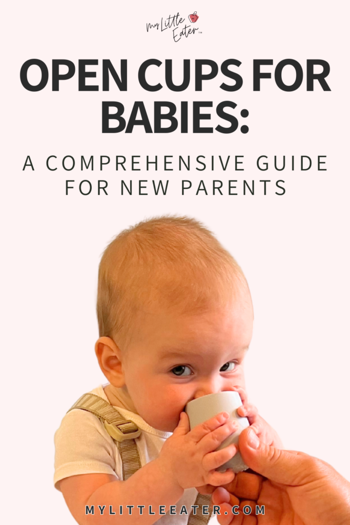 Open cups for babies: a comprehensive guide for new parents; baby grasps an open cup and brings it to baby's mouth.