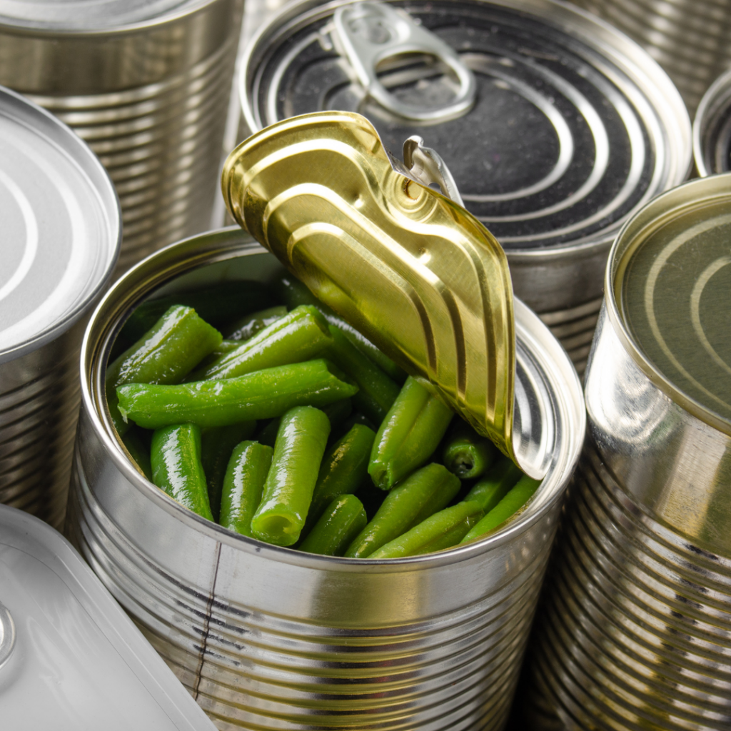 An open can of cooked green beans to serve to baby as solid food or to make green bean puree.