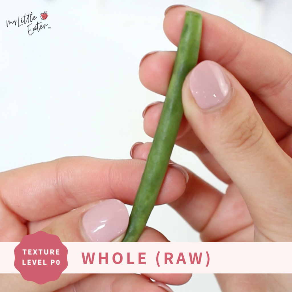 A raw, whole green bean for baby led weaning.