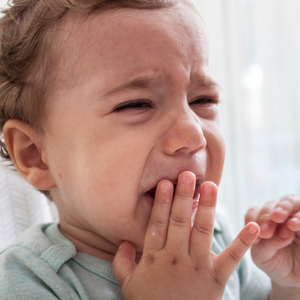 Baby's teething pain resulting in tears.