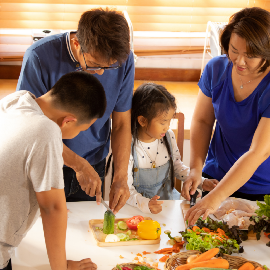 A family cooks together as a fun way to bond by having their kids start cooking favorite recipes at a young age.