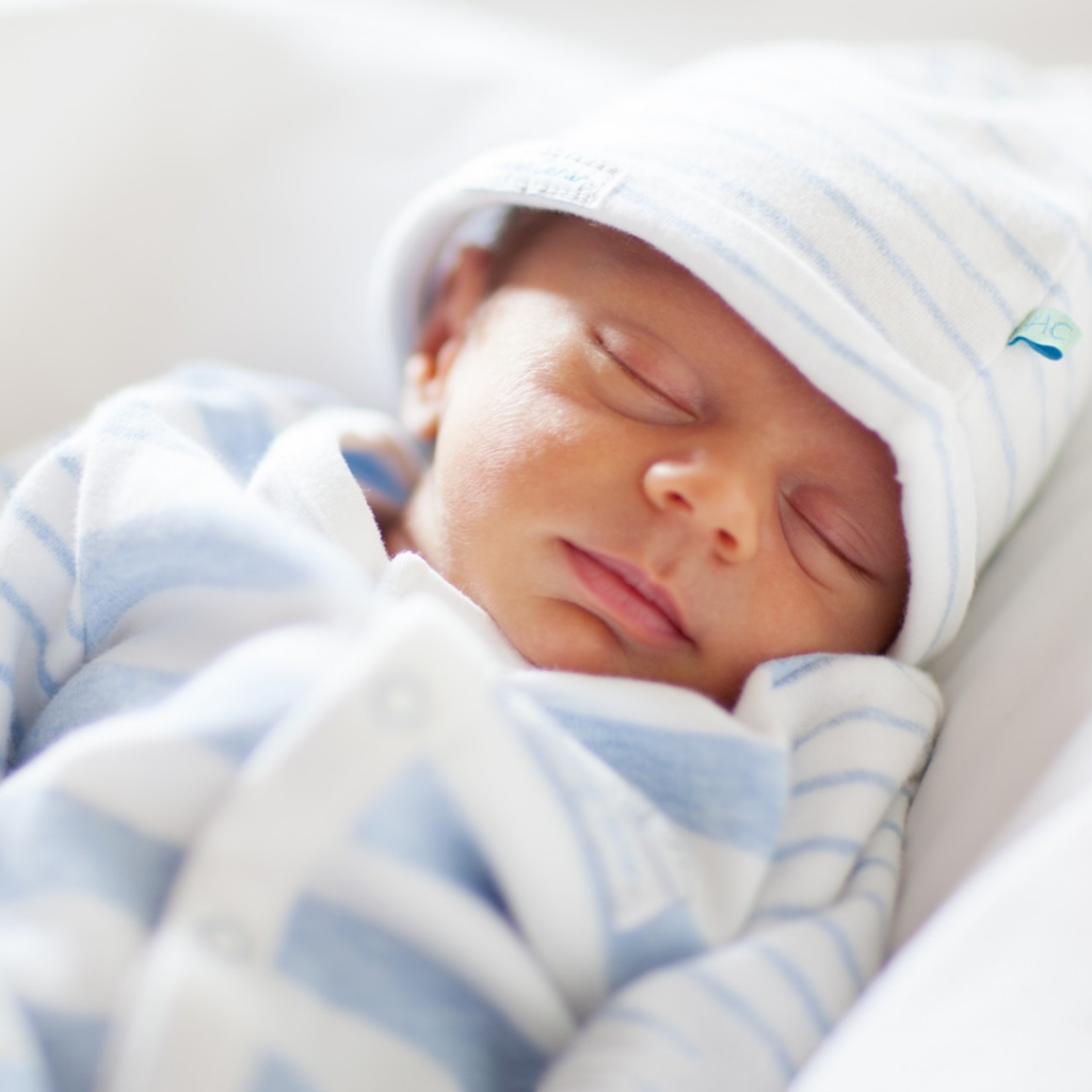 A newborn baby sleeps.