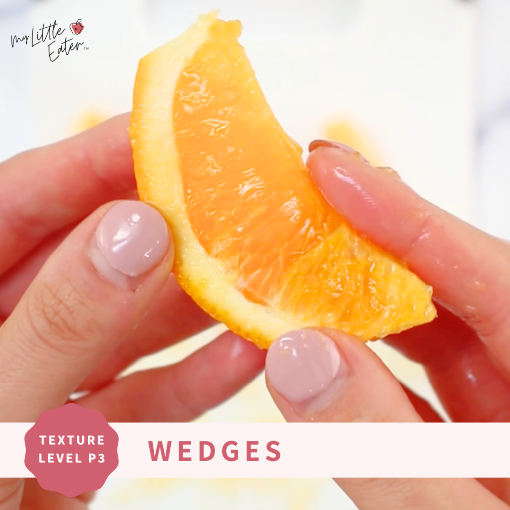 An orange cut into a wedge shape to safey serve oranges to babies.