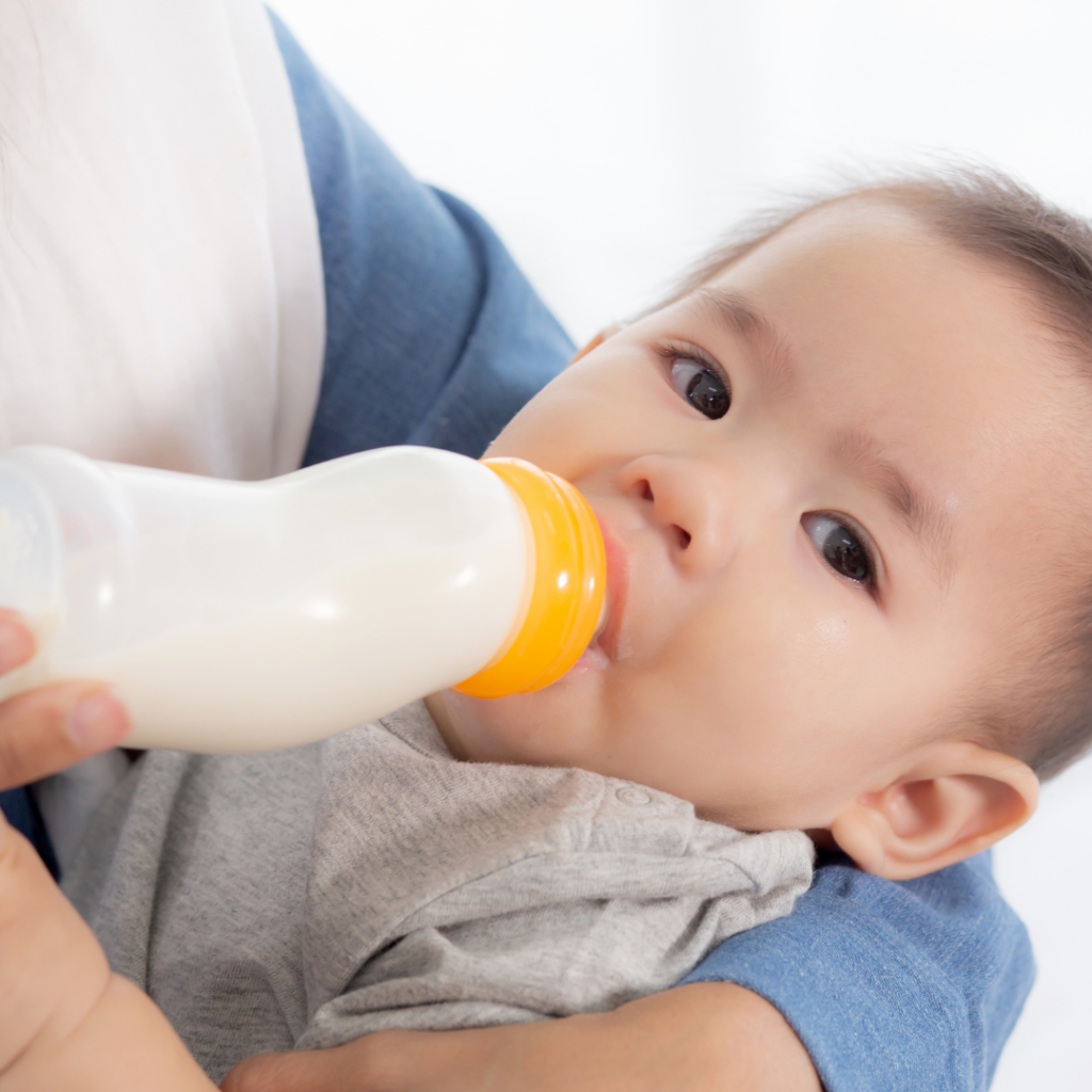 Baby drinking from a bottle.