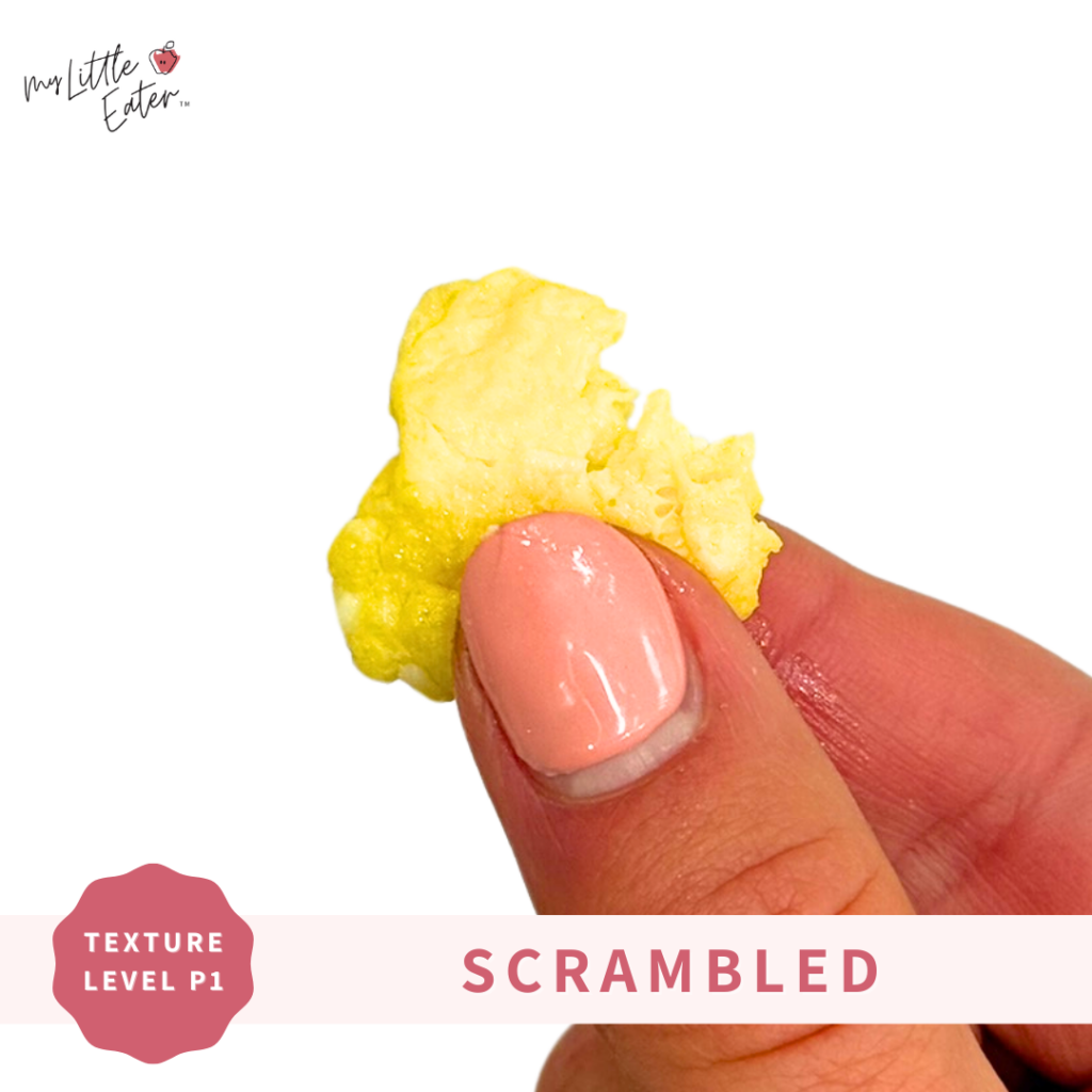 Scrambled eggs being held in a pincer grasp.