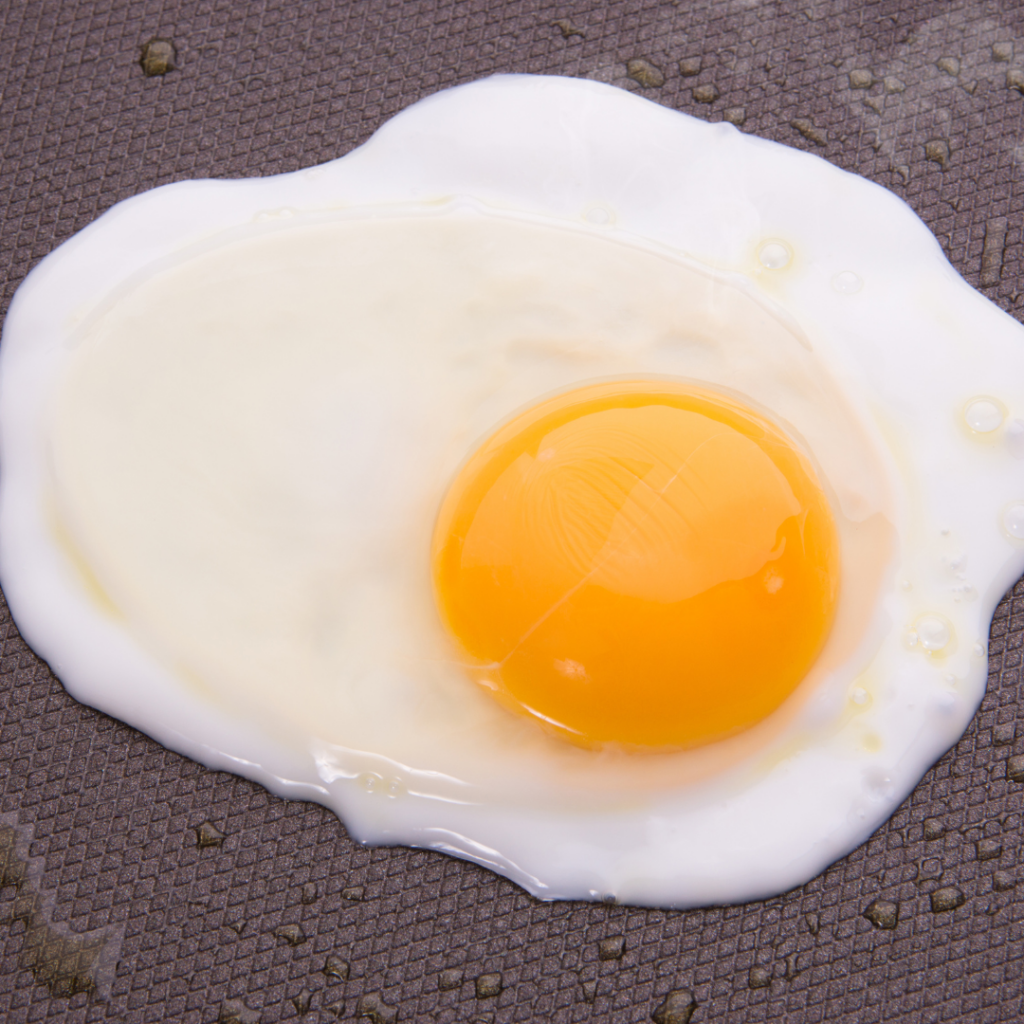 Undercooked egg white and yolk which can be the cause of bacterial food poisoning in babies.