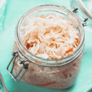 Fermented vegetables in a glass jar.