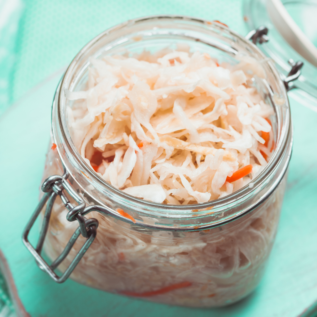 Fermented vegetables in a glass jar.