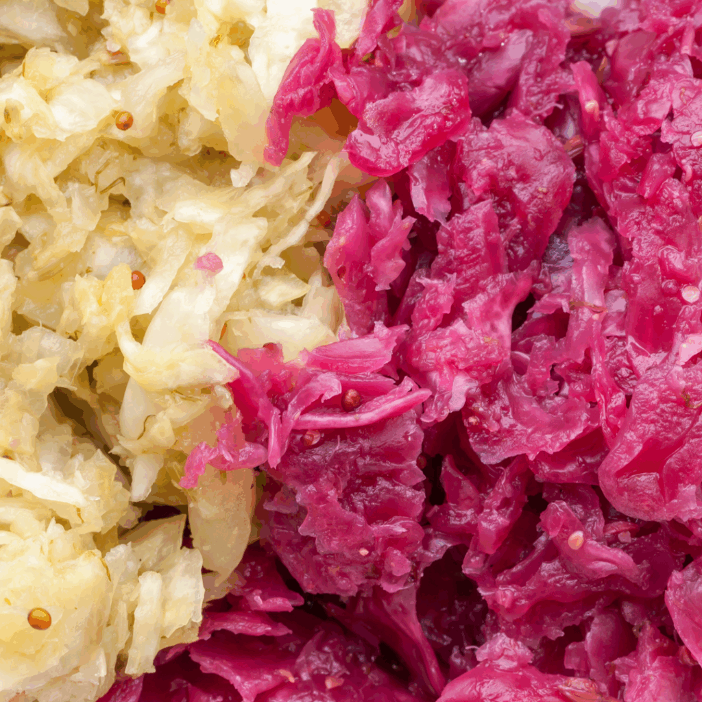 Other fermented vegetables, appears to be two types of cabbage (white and red cabbage) made into sauerkraut.
