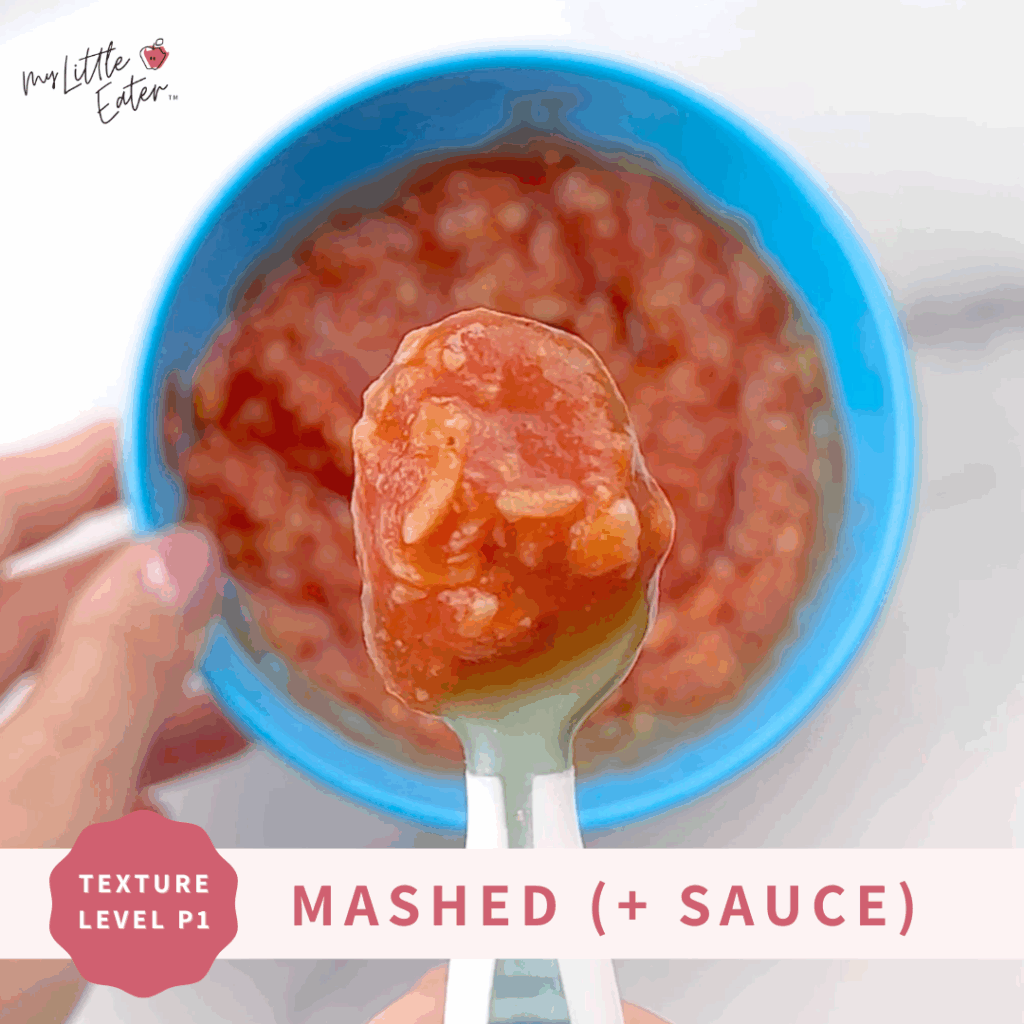 Mashed pasta mixed with sauce in a bowl.