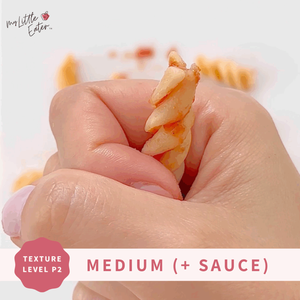 Rotini pasta being held in a palmar grasp.