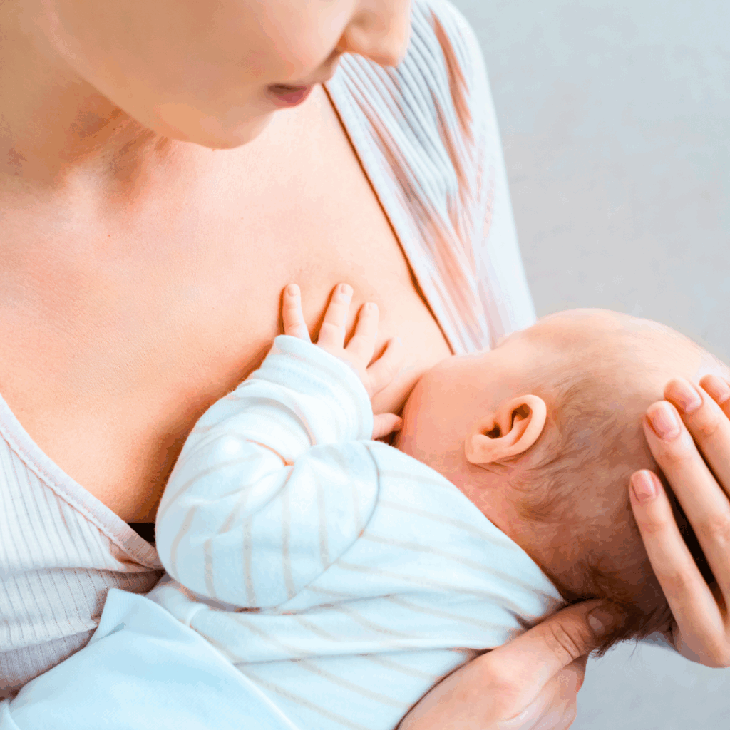 A mother breastfeeds her baby
