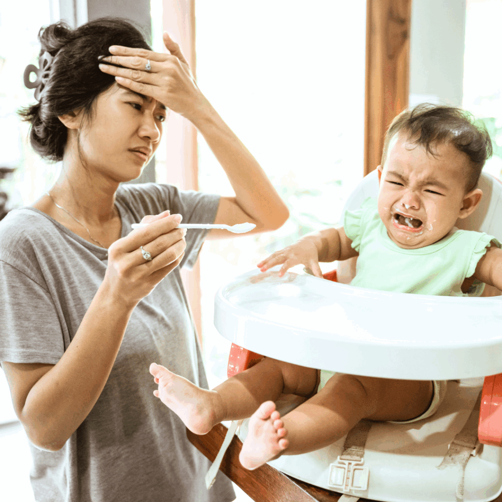 Baby crying eating purees