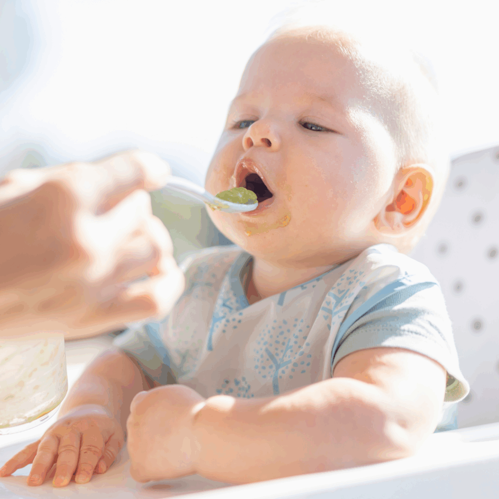 Baby opening mouth for pureed food