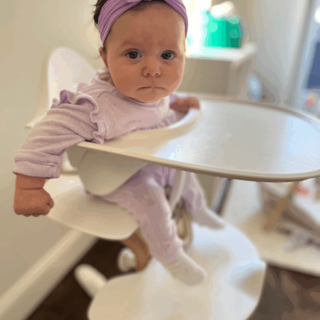 Baby leaning to the side in high chair