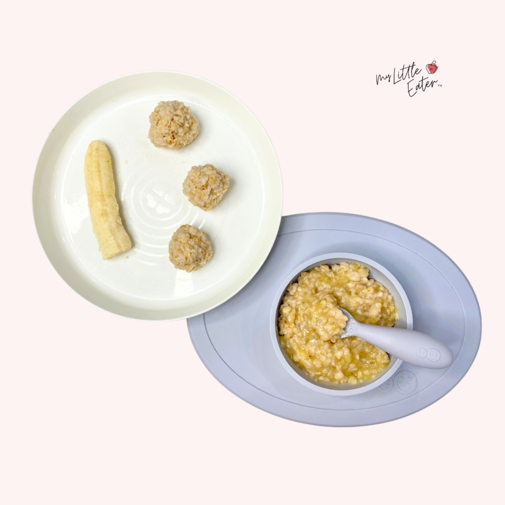 Plate and bowl showing age-appropriate baby foods for starting solids, including mashed banana oatmeal in a silicone bowl with a baby spoon, half a peeled banana, and soft banana oatmeal bites for self-feeding. The image demonstrates both puree and finger food options for baby-led feeding.
